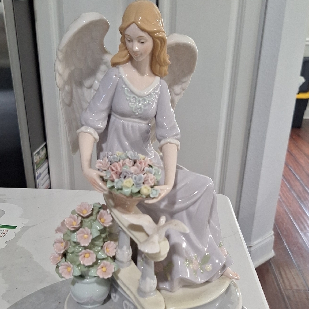Elegant Angel Figurine with Floral Bouquet